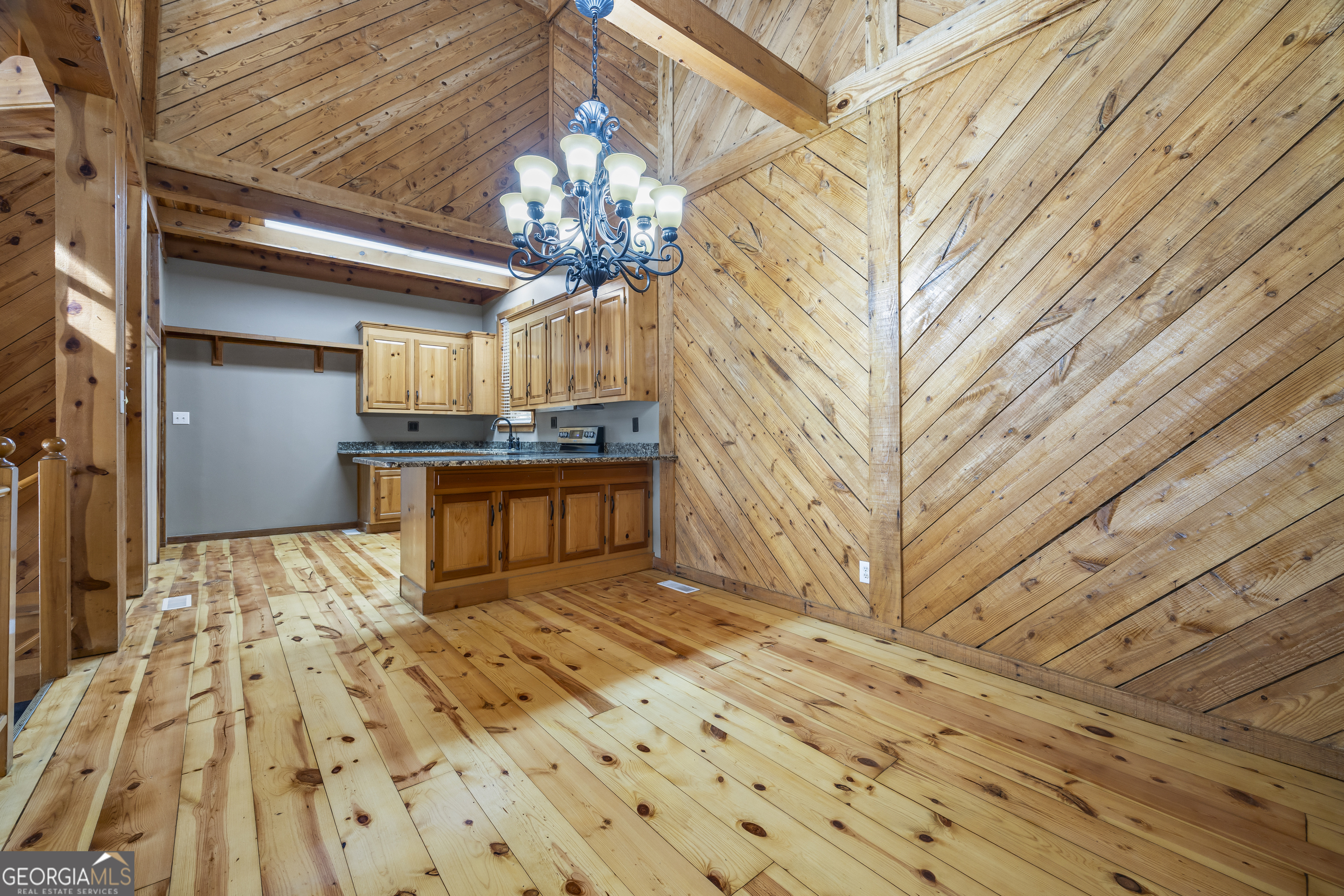 339 Ben Loudermilk Road Mount Airy, GA 30563 - Photo 20 of 49 a view of a livingroom with a chandelier furniture and wooden floor