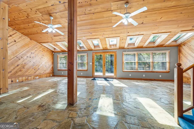 a spacious bathroom with a bathtub and shower