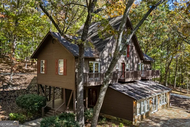a view of a house with a tree