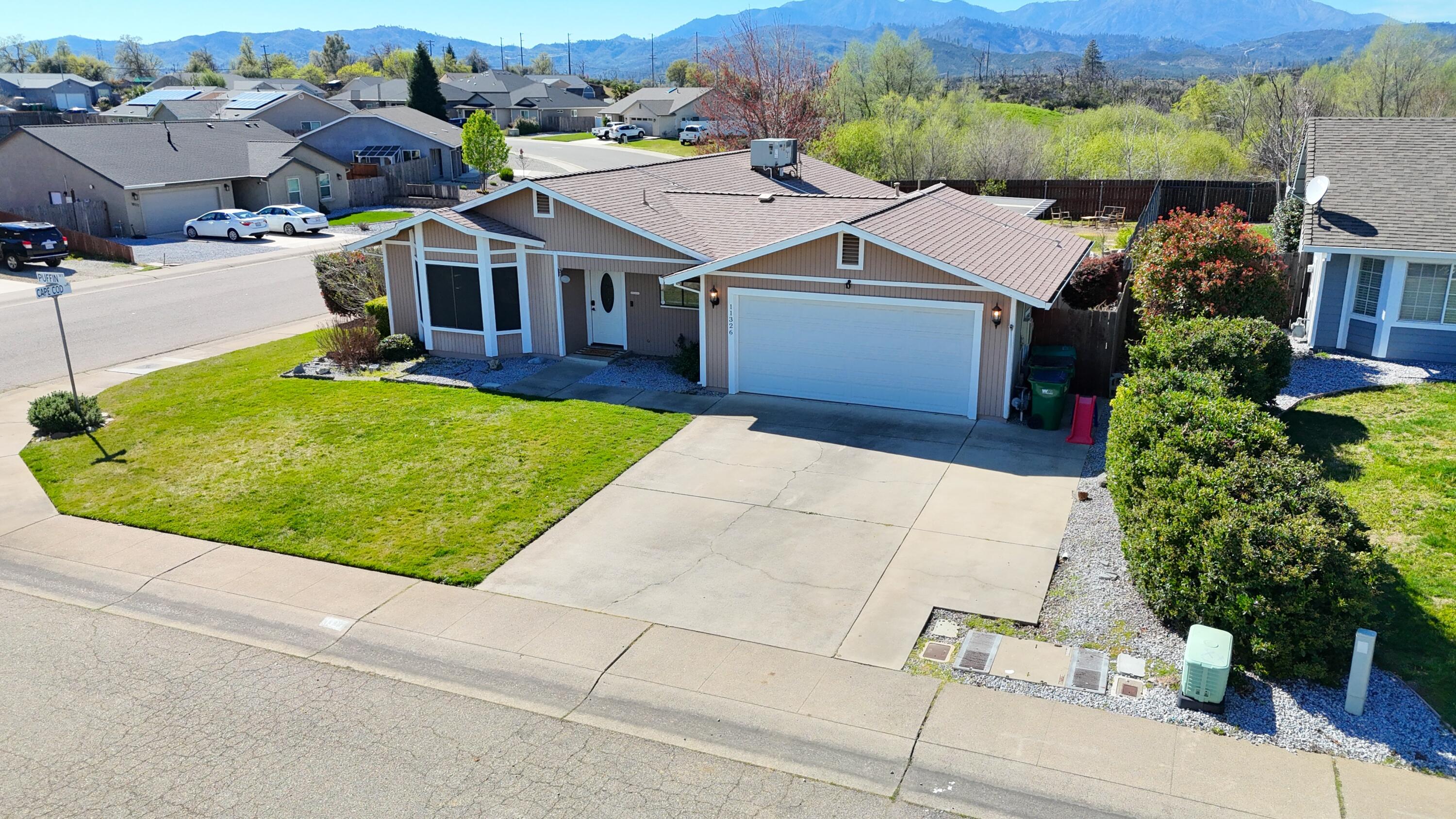 an aerial view of a house with garden space