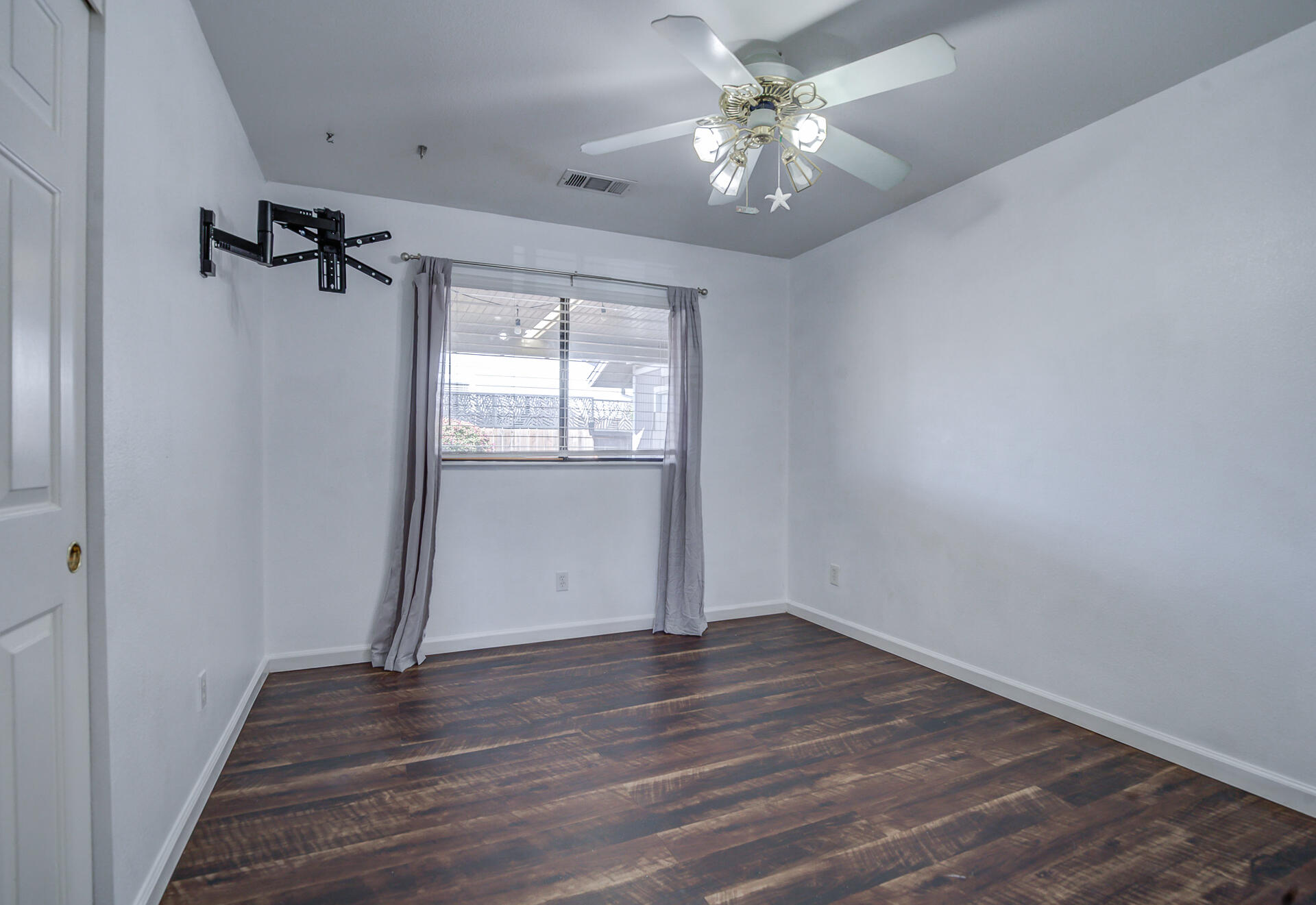 11326 Puffin Way Redding, CA 96003 - Photo 12 of 34 wooden floor in an empty room with a window