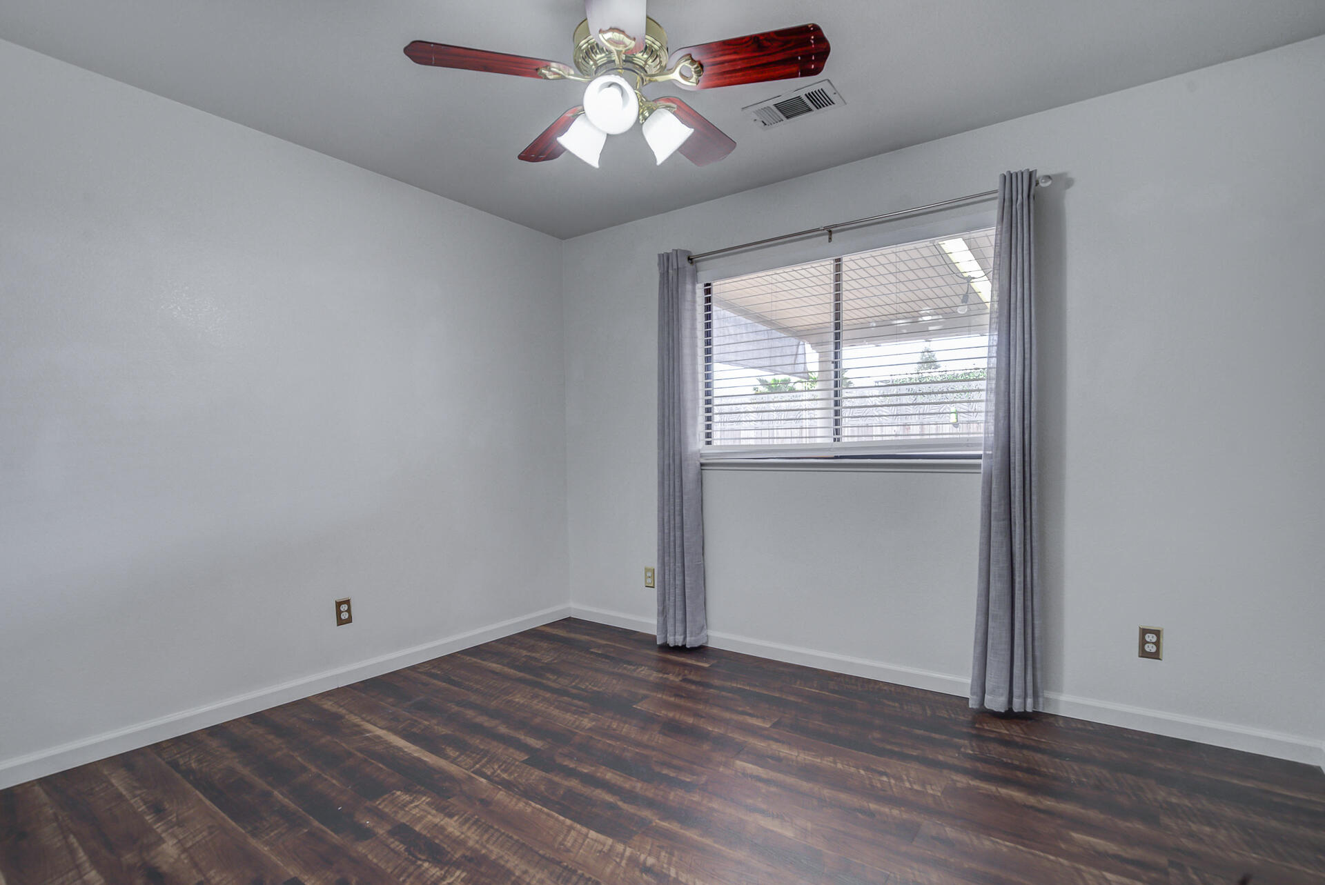 11326 Puffin Way Redding, CA 96003 - Photo 15 of 34 a view of empty room with wooden floor and fan