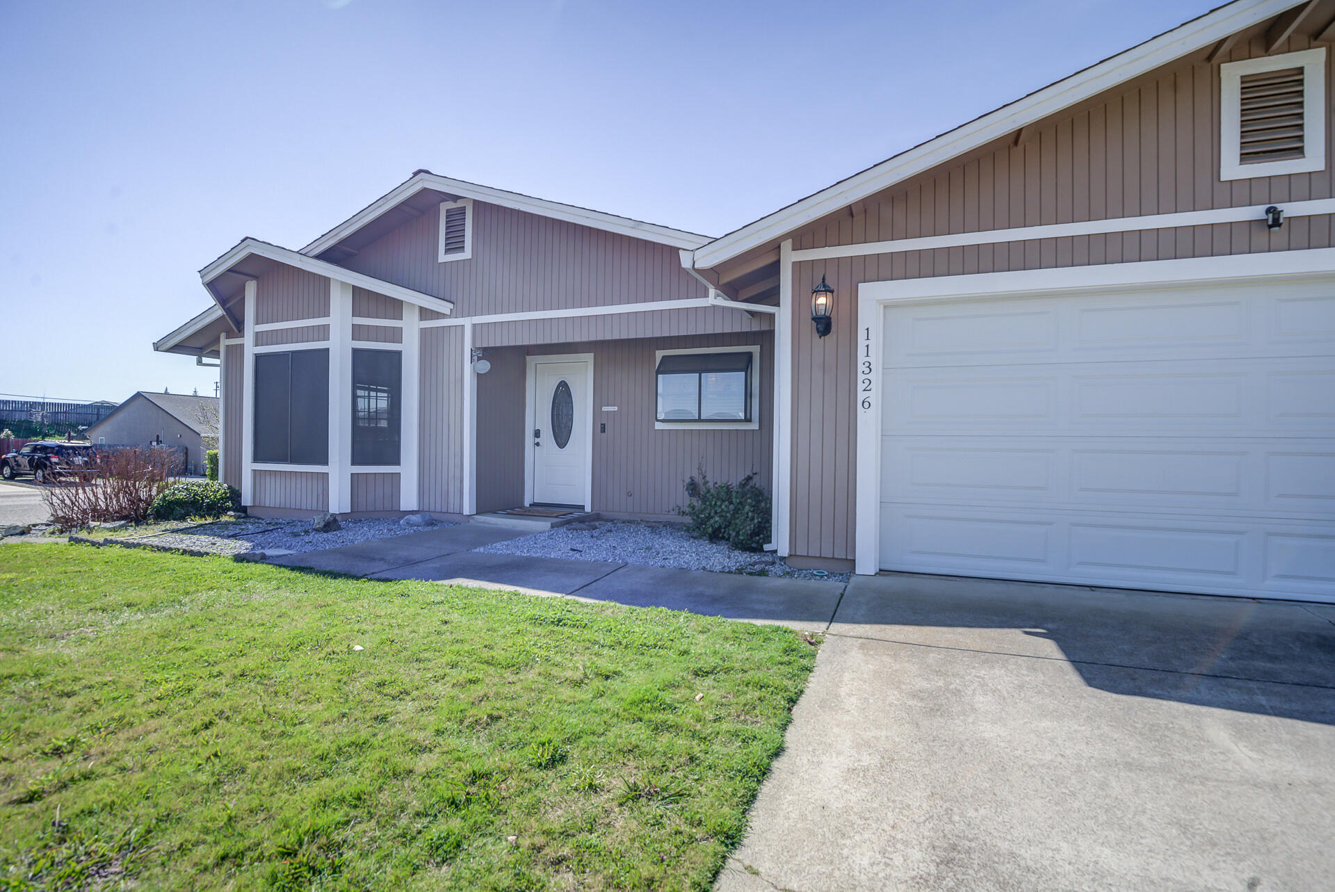 11326 Puffin Way Redding, CA 96003 - Photo 2 of 34 a view of front of house with a yard
