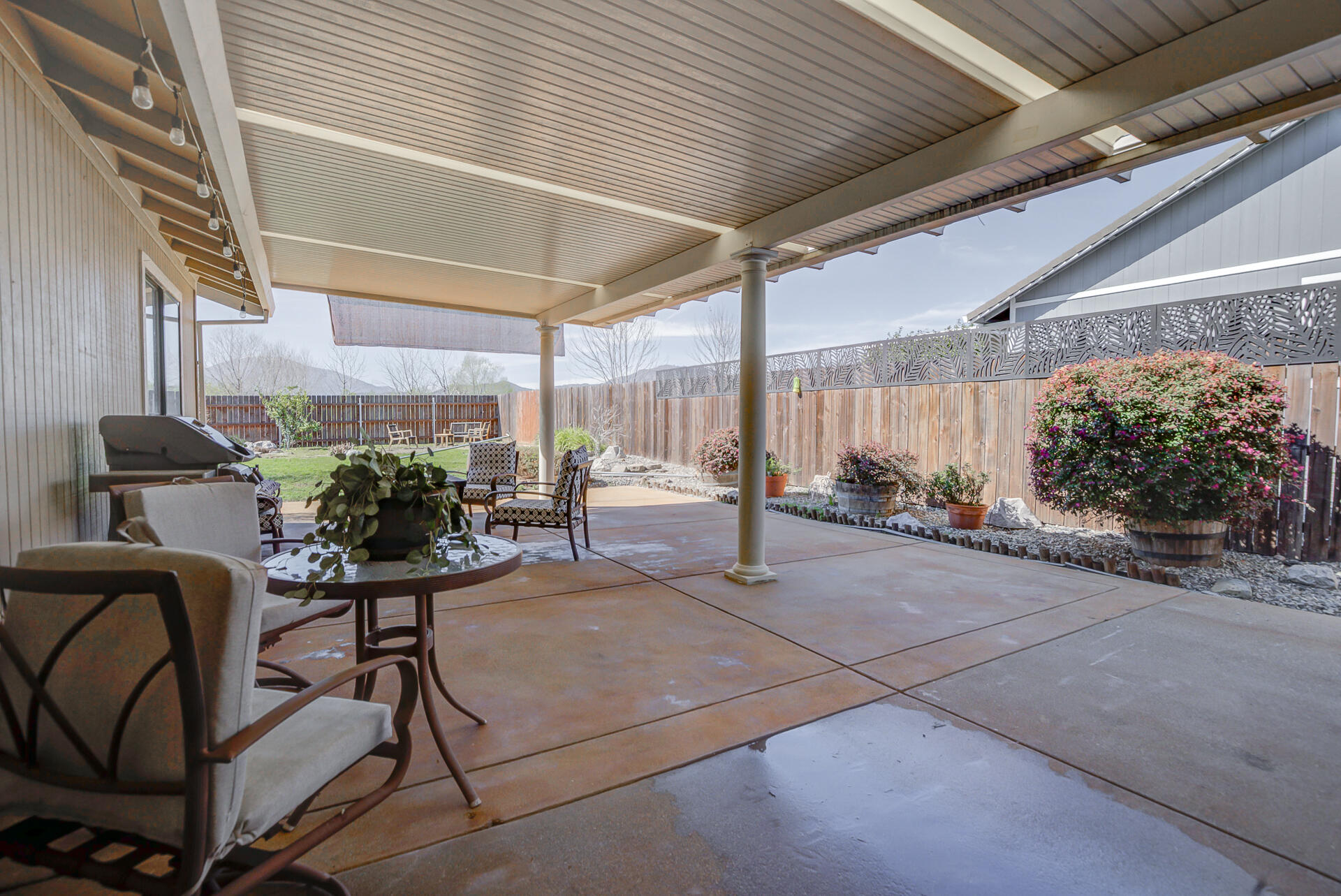 11326 Puffin Way Redding, CA 96003 - Photo 22 of 34 a view of a porch with furniture and floor to ceiling window