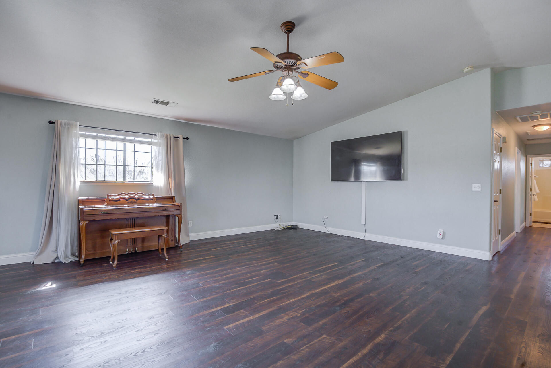 11326 Puffin Way Redding, CA 96003 - Photo 4 of 34 a living room with furniture and a flat screen tv