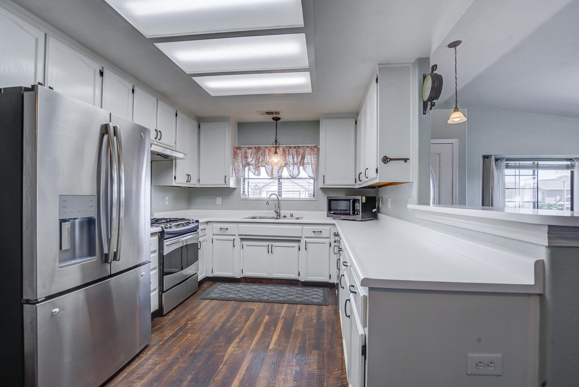 11326 Puffin Way Redding, CA 96003 - Photo 9 of 34 a kitchen with stainless steel appliances a refrigerator sink and stove