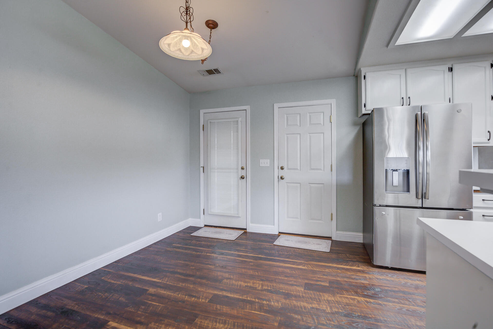 11326 Puffin Way Redding, CA 96003 - Photo 10 of 34 a view of a kitchen with wooden floor and refrigerator