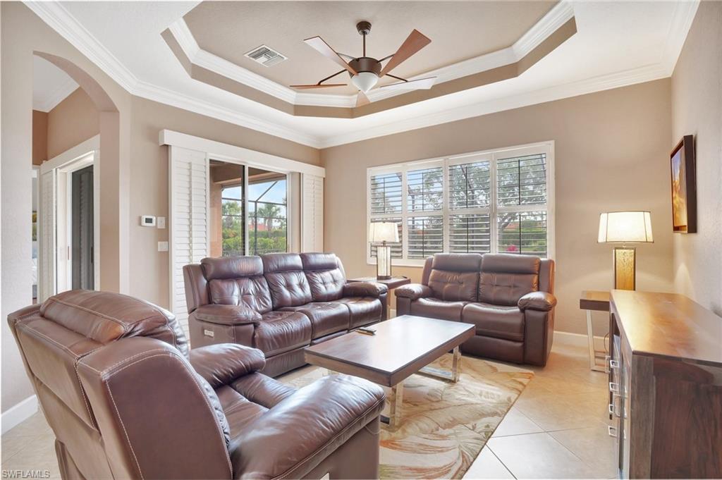 7903 Founders Circle Naples, FL 34104 - Photo 12 of 32 a living room with furniture and a large window