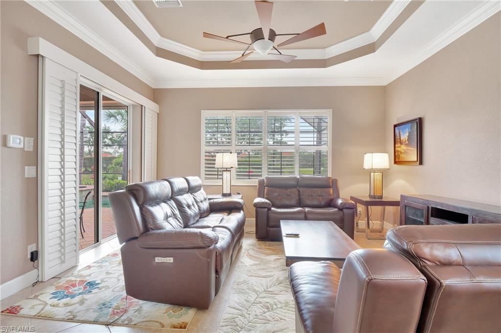 7903 Founders Circle Naples, FL 34104 - Photo 13 of 32 a living room with furniture and a large window