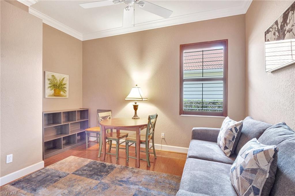7903 Founders Circle Naples, FL 34104 - Photo 14 of 32 a view of a livingroom with furniture and window