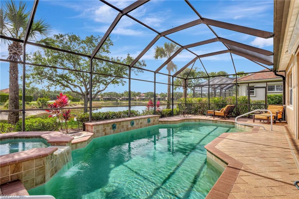 7903 Founders Circle Naples, FL 34104 - Photo 26 of 32 a view of a swimming pool with a patio