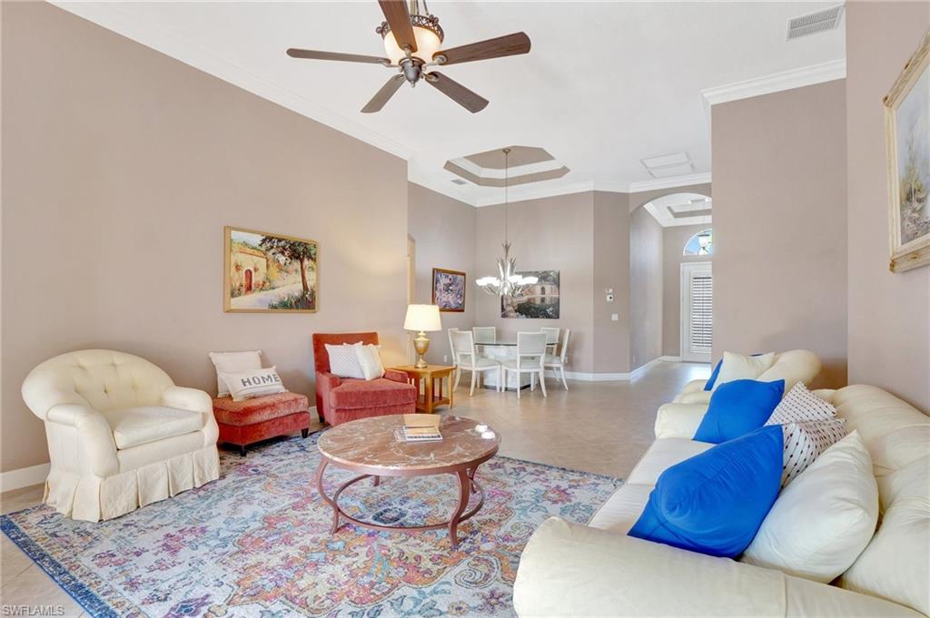 7903 Founders Circle Naples, FL 34104 - Photo 5 of 32 a living room with furniture and a wooden floor