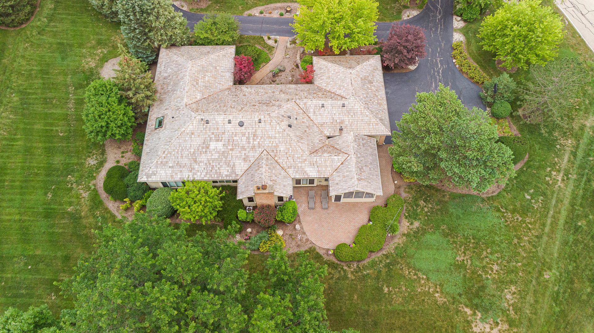 2220 Applecross Road Inverness, IL 60010 - Photo 35 of 36 an aerial view of a house with a yard and lake view