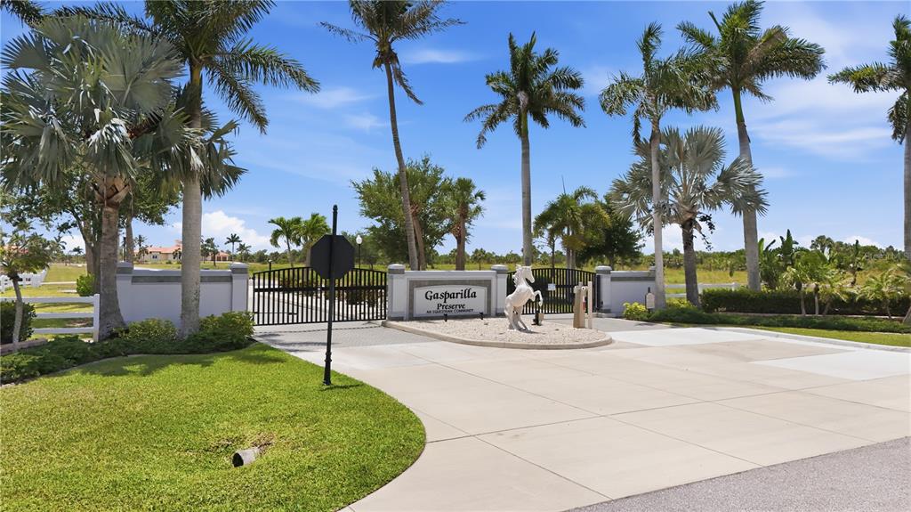 11610 Bridle Path Lane Placida, FL 33946 - Photo 15 of 18 a view of a swimming pool with a table and chairs