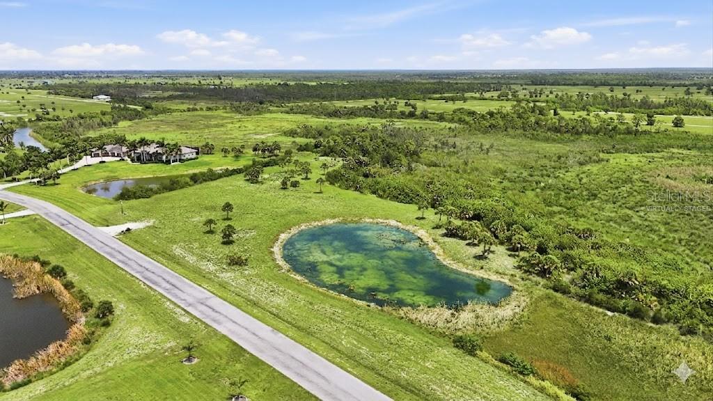 11610 Bridle Path Lane Placida, FL 33946 - Photo 4 of 18 a view of a field with an ocean view