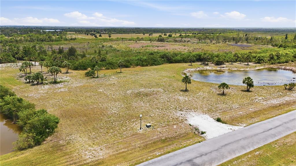 11610 Bridle Path Lane Placida, FL 33946 - Photo 8 of 18 a view of a lake with a yard