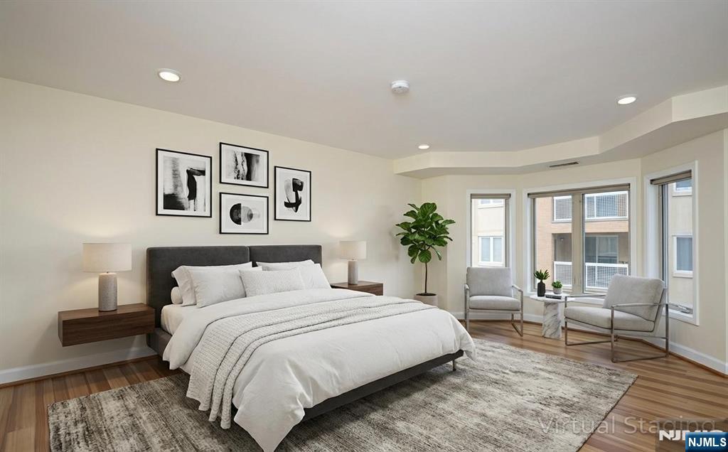 307 Jefferson Court Edgewater, NJ 07020 - Photo 15 of 36 a bedroom with a large bed and a couch