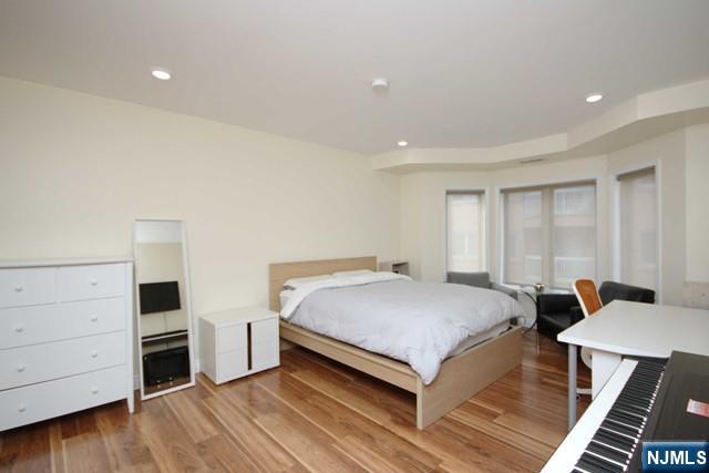 307 Jefferson Court Edgewater, NJ 07020 - Photo 16 of 36 a bed room with a bed and a window