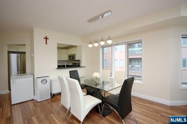 307 Jefferson Court Edgewater, NJ 07020 - Photo 10 of 36 a view of a dining room with furniture and wooden floor