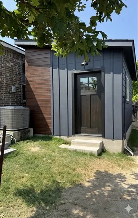 a backyard of a house with seating space