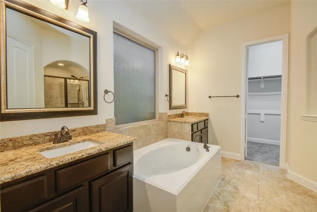 a bathroom with a granite countertop sink mirror and a