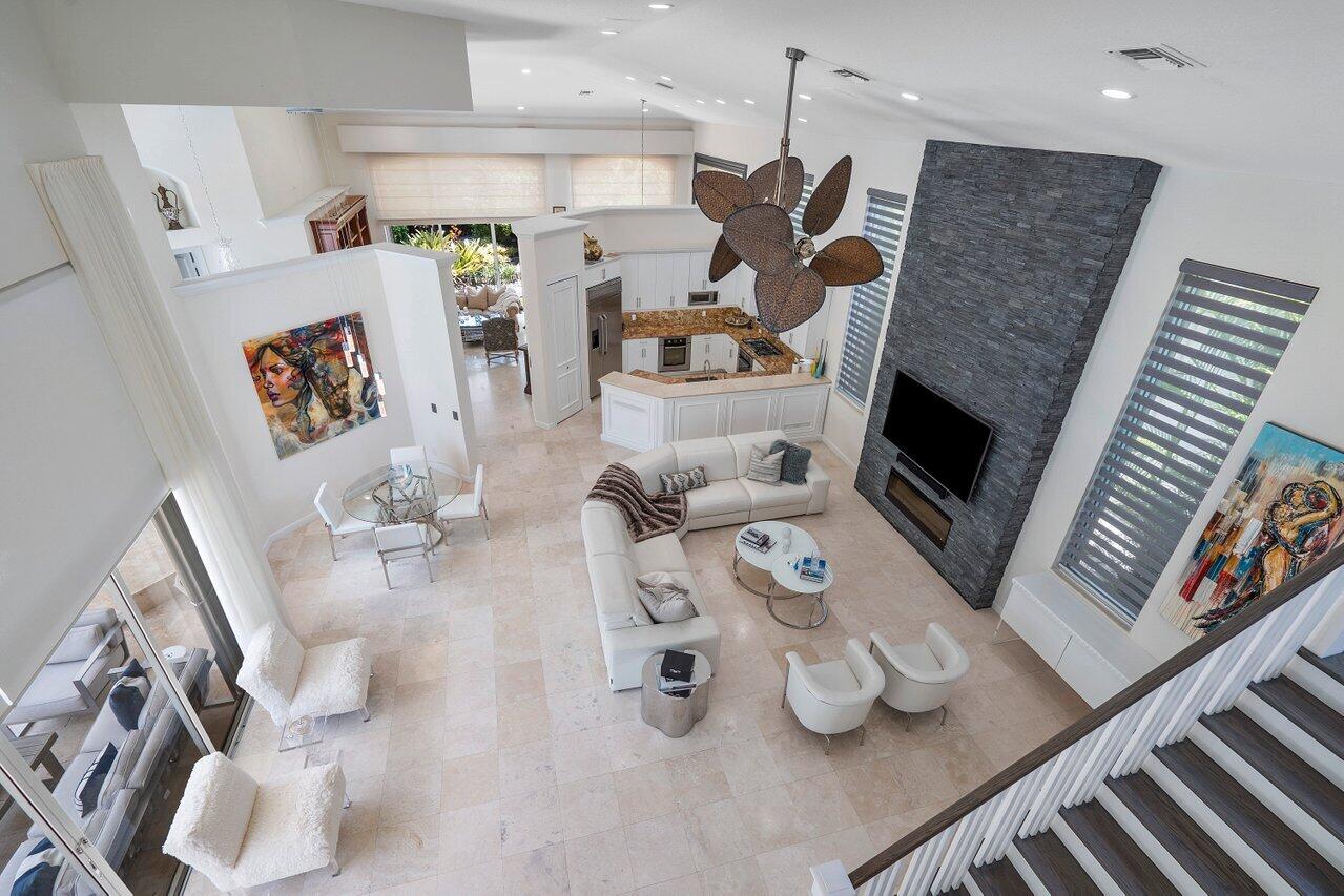 6379 Avalon Pointe Court Boca Raton, FL 33496 - Photo 13 of 37 a living room with furniture and a fireplace