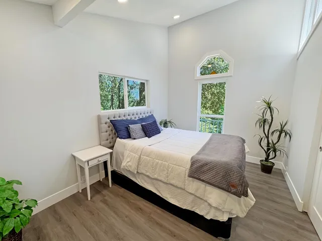 a bedroom with a bed and a table