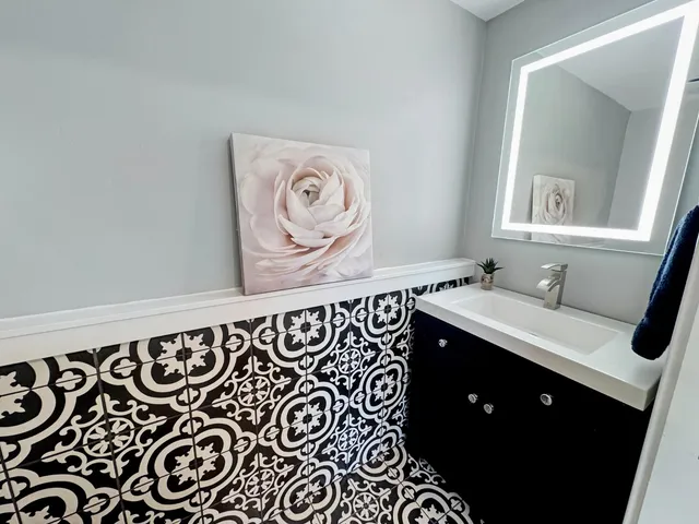 a bathroom with a sink and a mirror