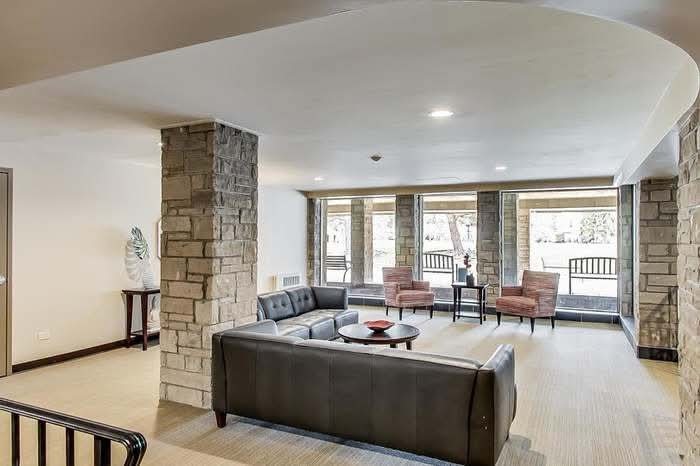 2500 Windsor Mall, Unit 2D Park Ridge, IL 60068 - Photo 2 of 13 a living room with furniture and a large window