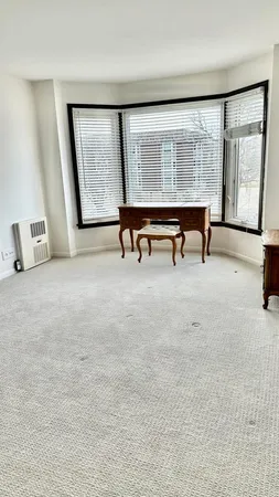 a view of an empty room with large window