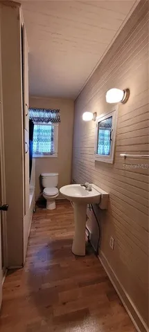 a view of a bathroom with a sink and a window