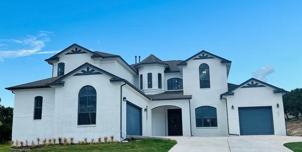 a front view of a house with yard