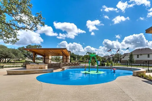 a view of a fountain with swimming pool