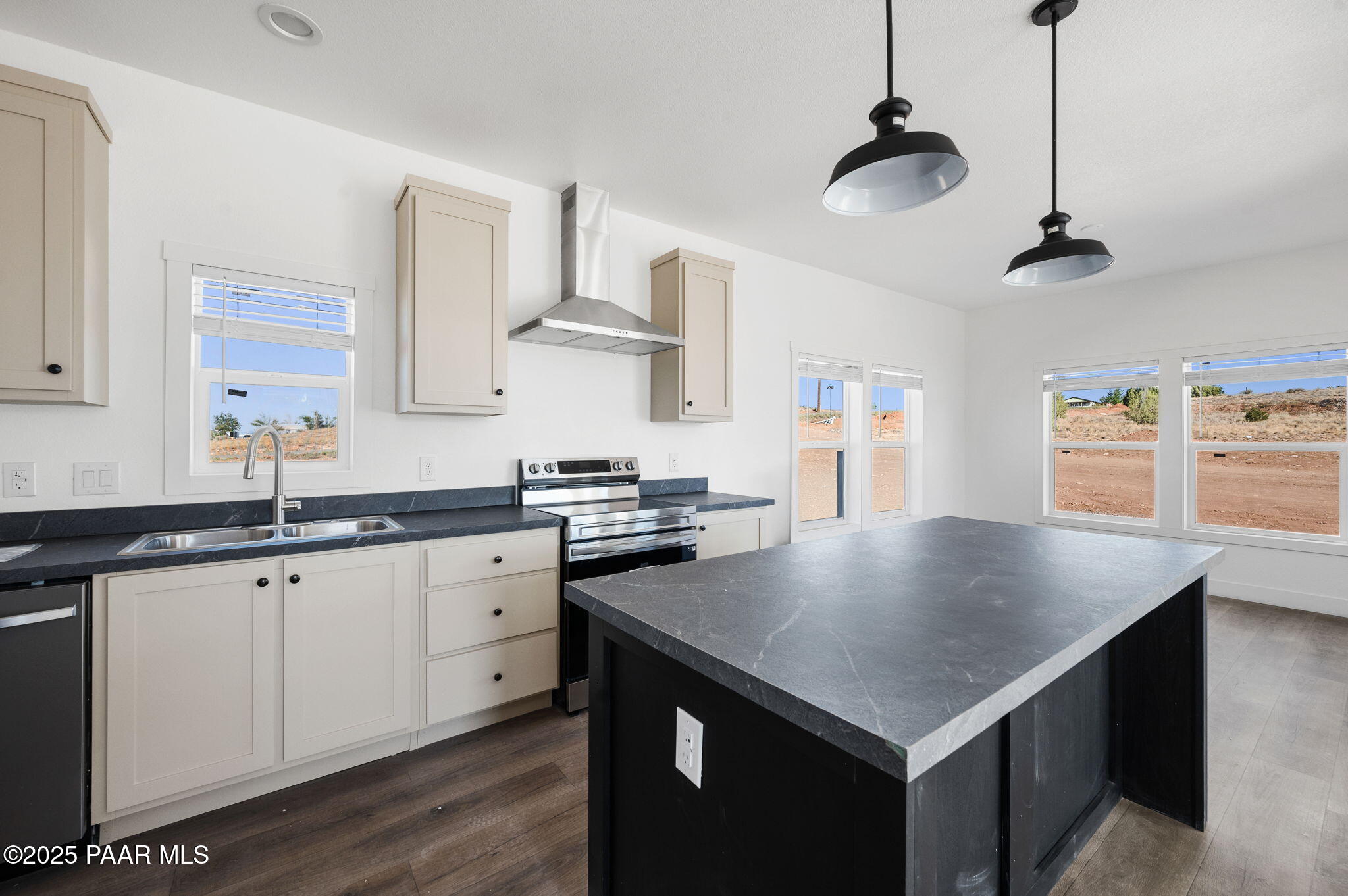39 East Abra Road Paulden, AZ 86334 - Photo 7 of 23 a kitchen with granite countertop a sink a center island and stainless steel appliances