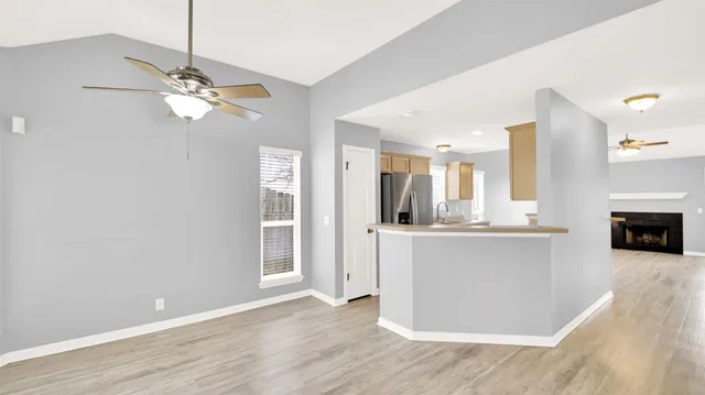 a view of kitchen with granite countertop cabinets and outdoor space