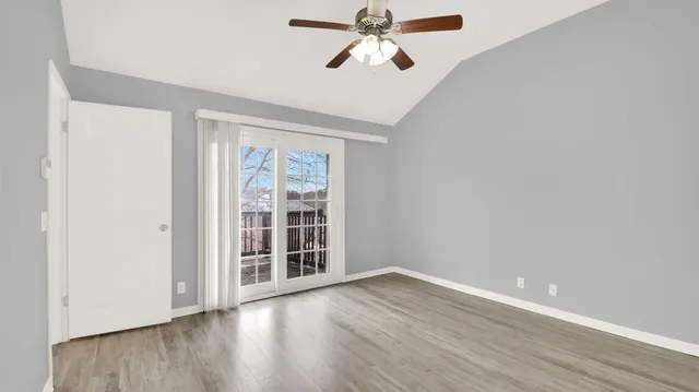 a bathroom with a bathtub shower sink vanity and toilet