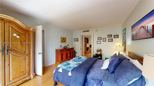 a bed room with a bed and furniture