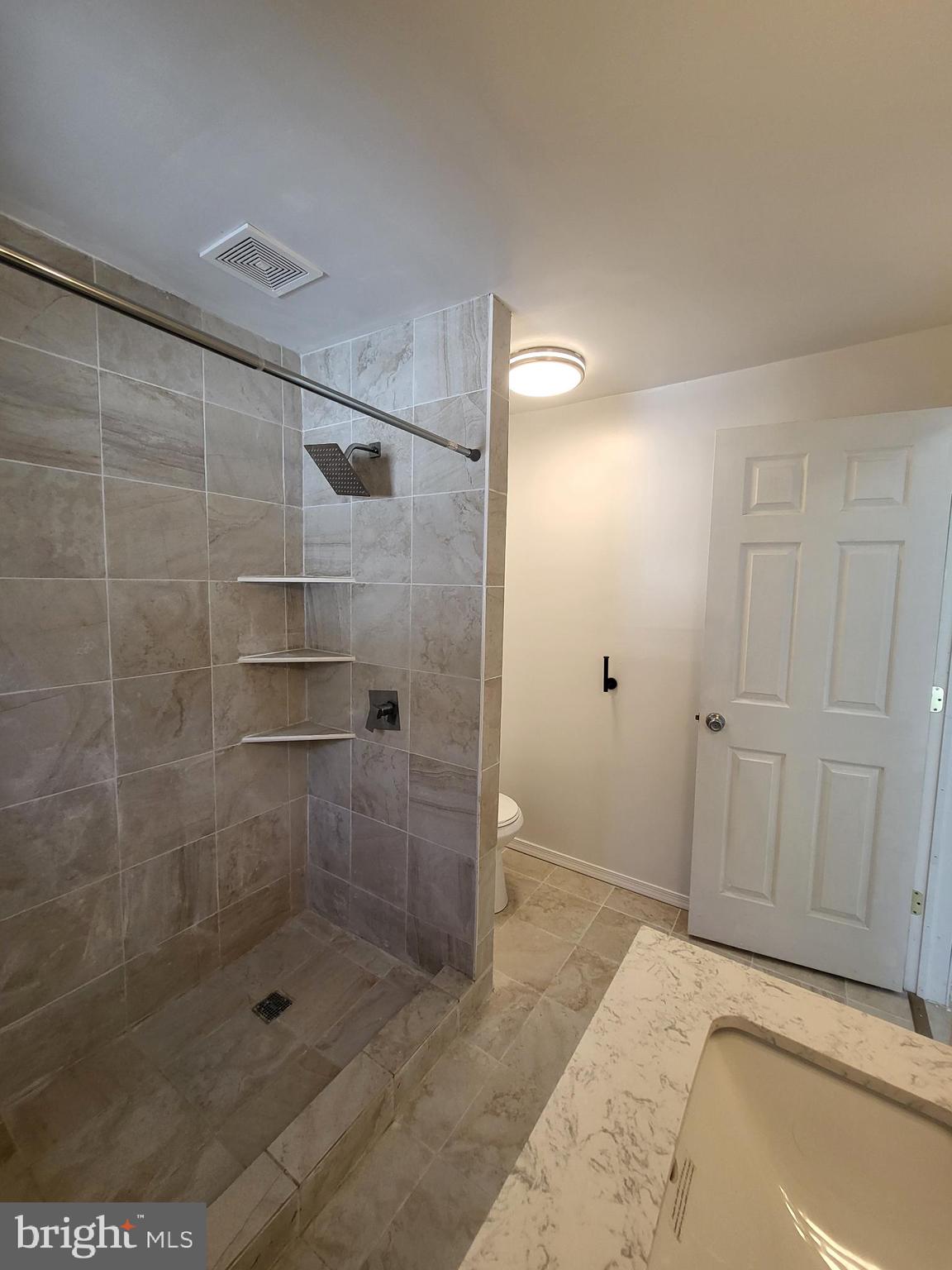 221 East Cameron Street Shamokin, PA 17872 - Photo 17 of 25 Modern bathroom with elegant tile design.
