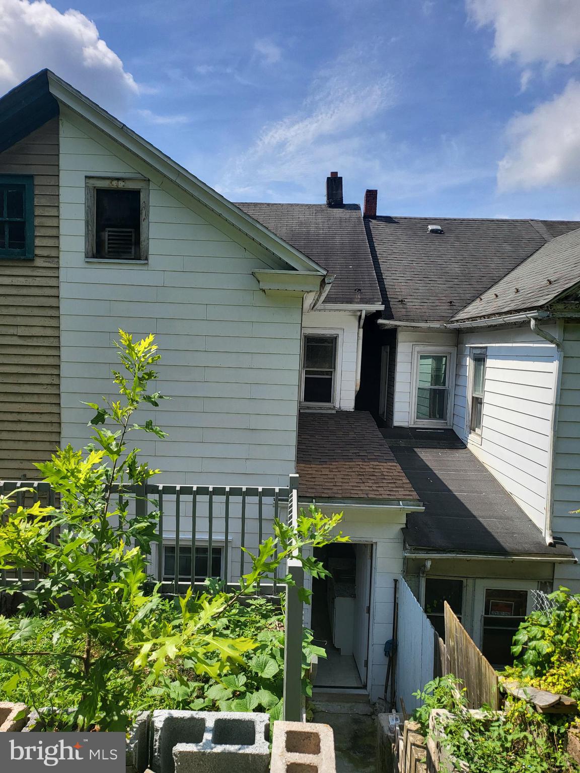 221 East Cameron Street Shamokin, PA 17872 - Photo 24 of 25 Charming duplex with lush greenery backdrop.