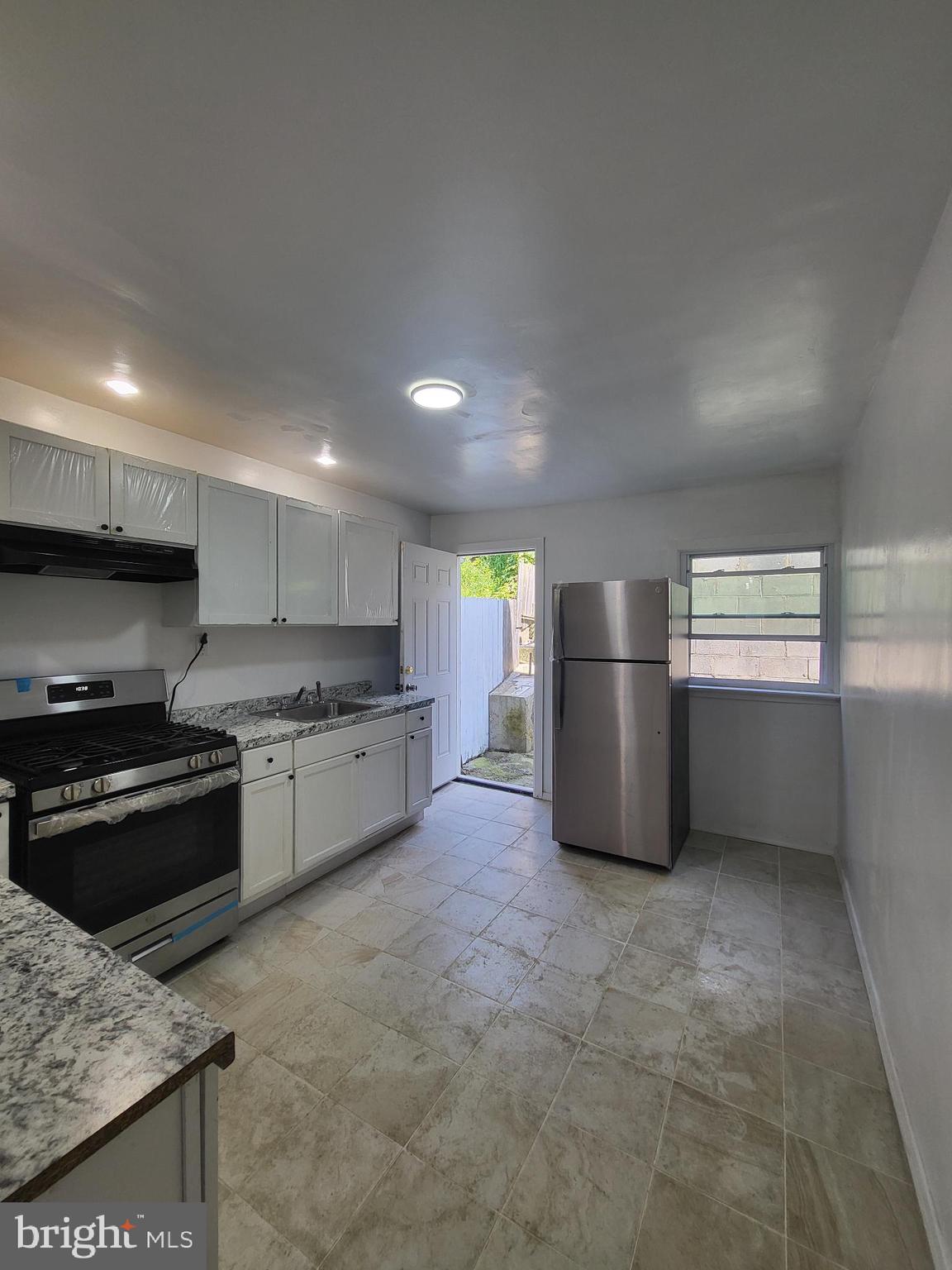 221 East Cameron Street Shamokin, PA 17872 - Photo 8 of 25 Bright and airy kitchen with outdoor access.