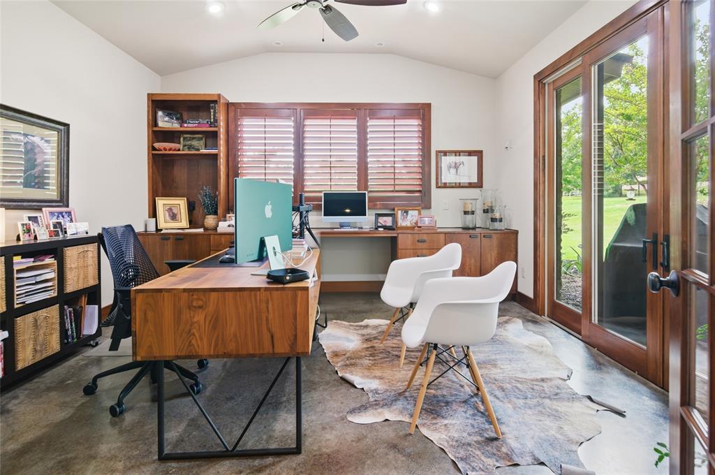 1138 Bancroft Road Keller, TX 76248 - Photo 26 of 39 Spacious room featuring vaulted ceilings, industrial-finish flooring, and built-in wood cabinetry