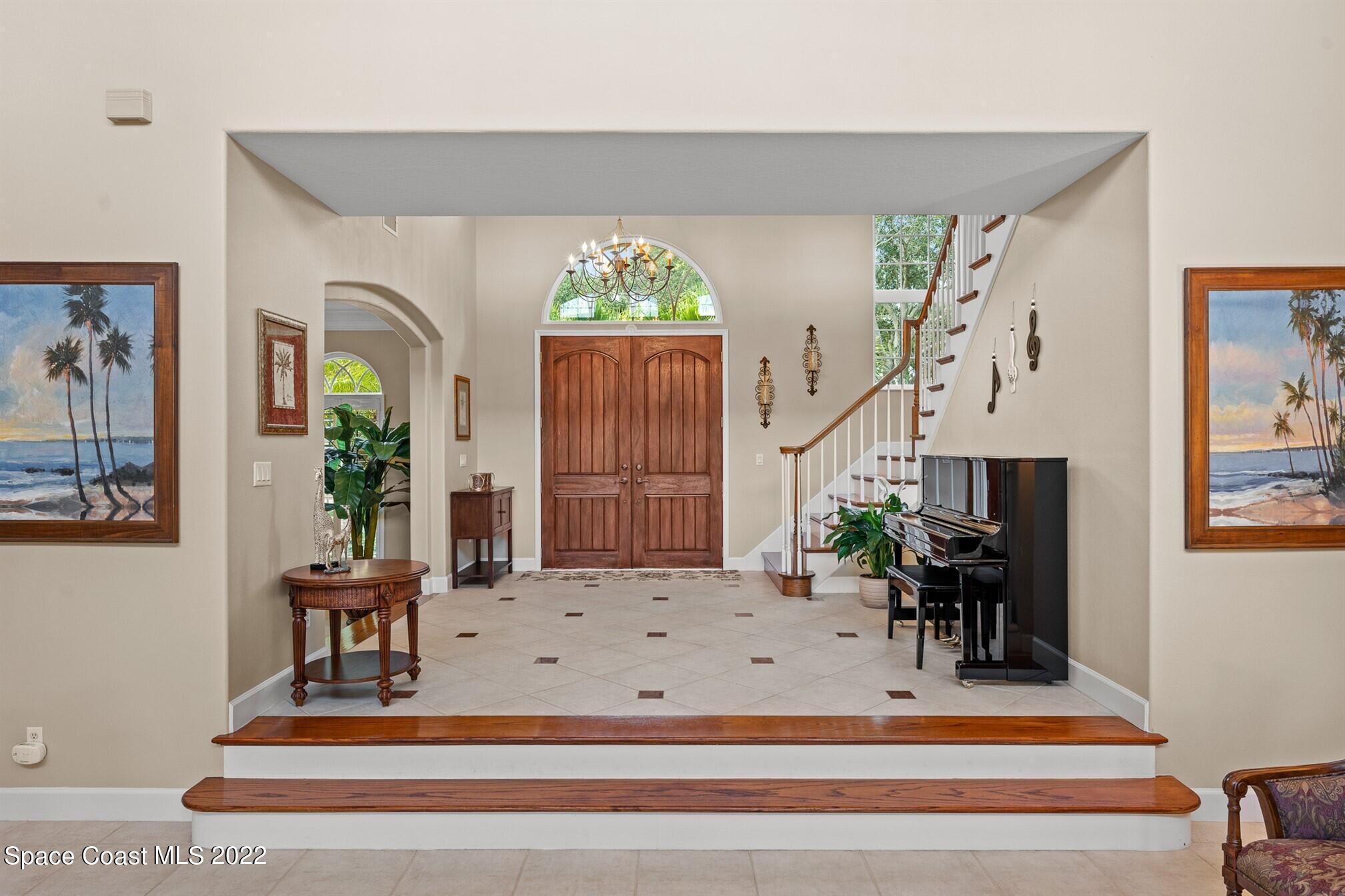 581 Nightingale Drive Indialantic, FL 32903 - Photo 11 of 67 a view of hall way with furniture and paintings on the wall