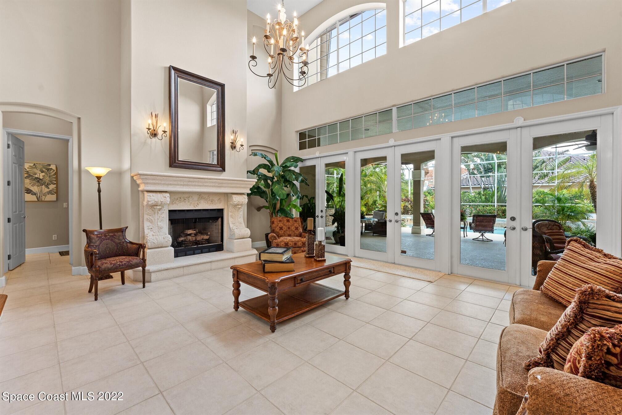 581 Nightingale Drive Indialantic, FL 32903 - Photo 13 of 67 a living room with furniture and a fireplace
