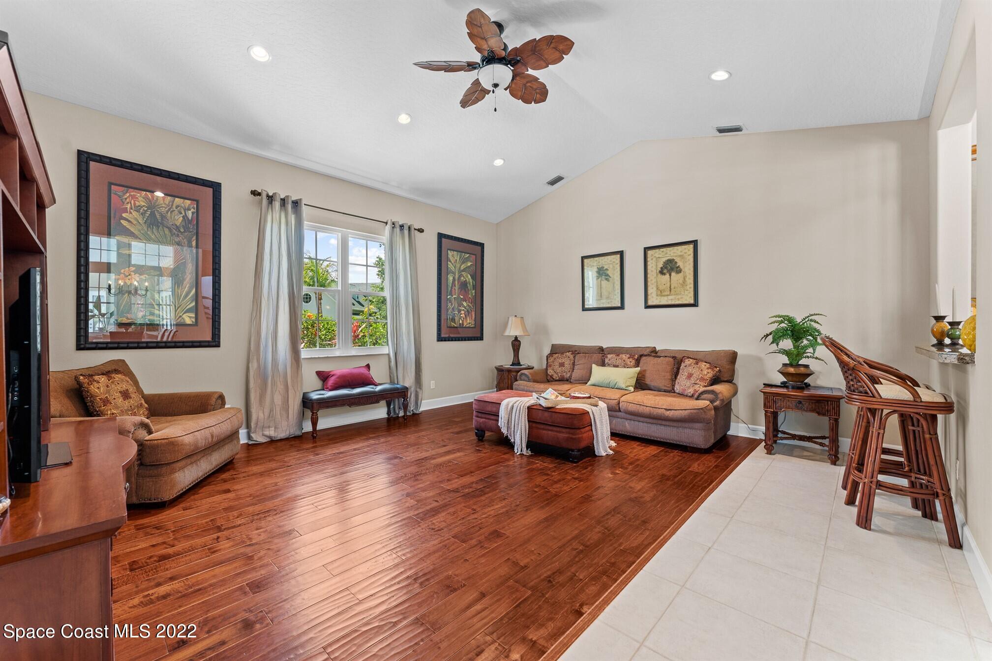 581 Nightingale Drive Indialantic, FL 32903 - Photo 22 of 67 a living room with furniture and a large window