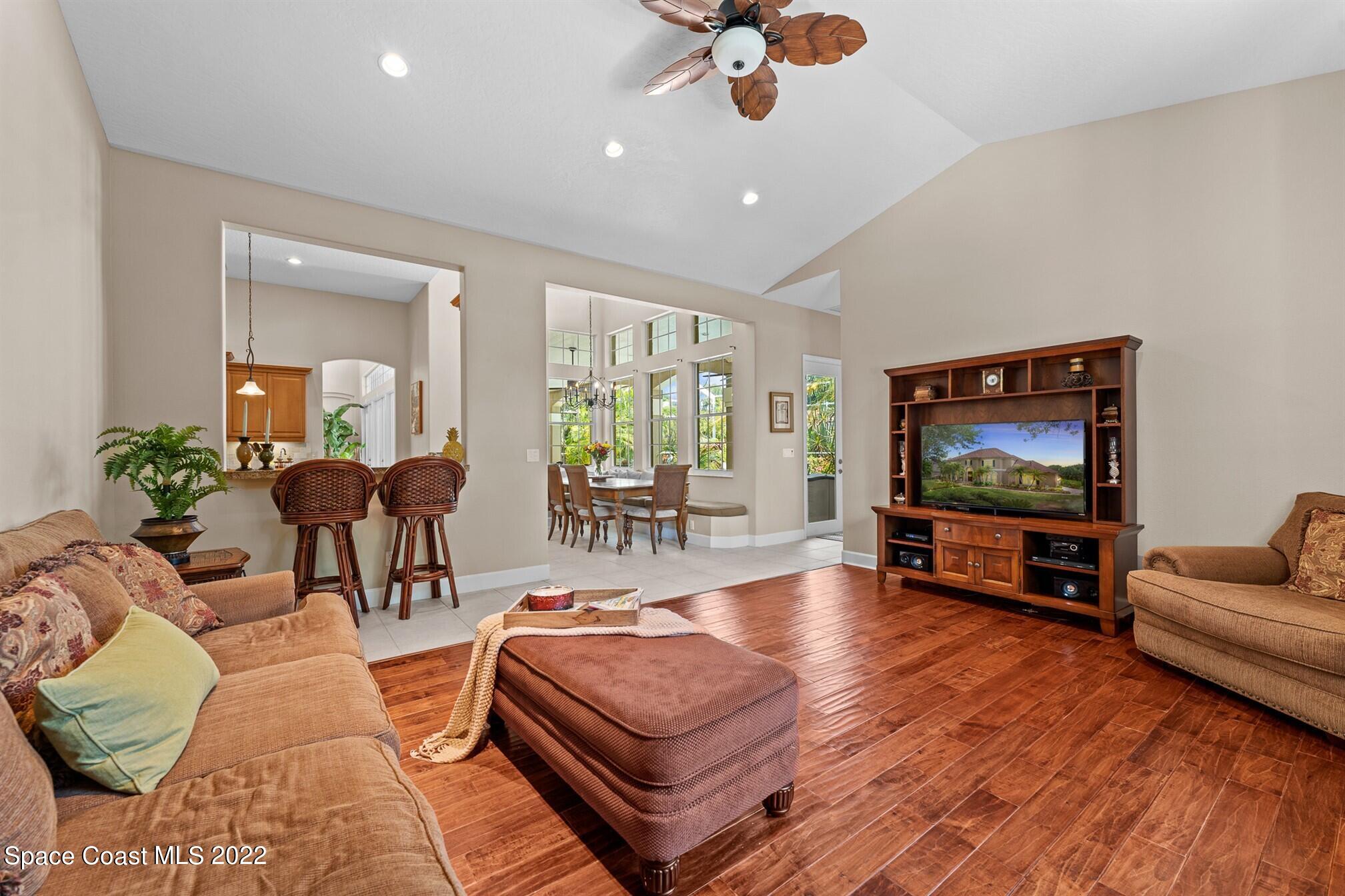 581 Nightingale Drive Indialantic, FL 32903 - Photo 23 of 67 a living room with furniture and a flat screen tv