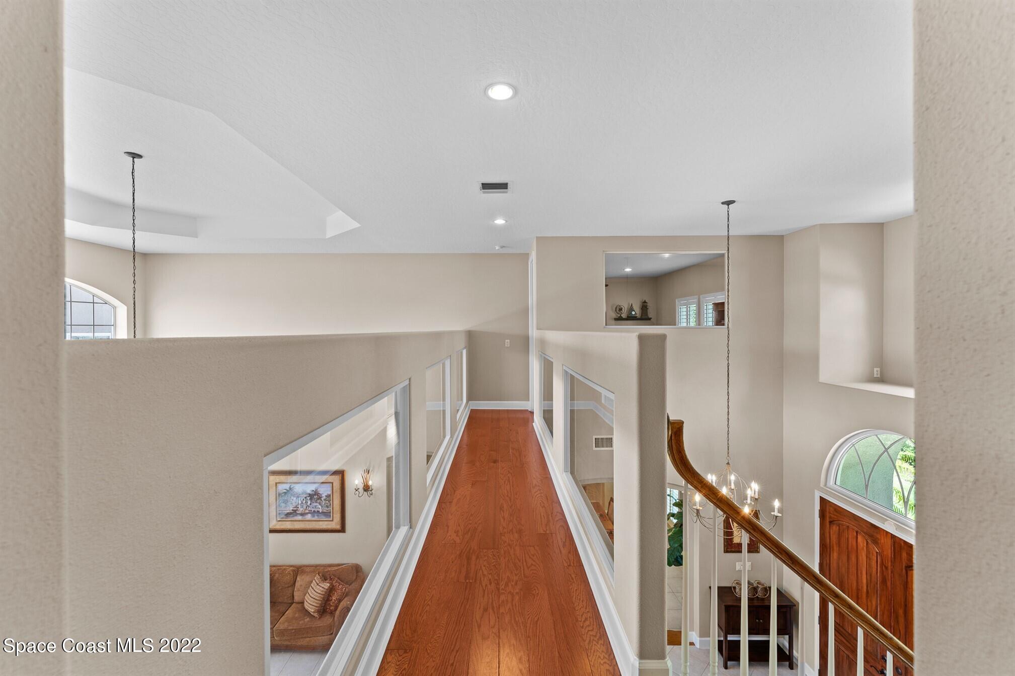 581 Nightingale Drive Indialantic, FL 32903 - Photo 32 of 67 a view of an entryway with wooden floor
