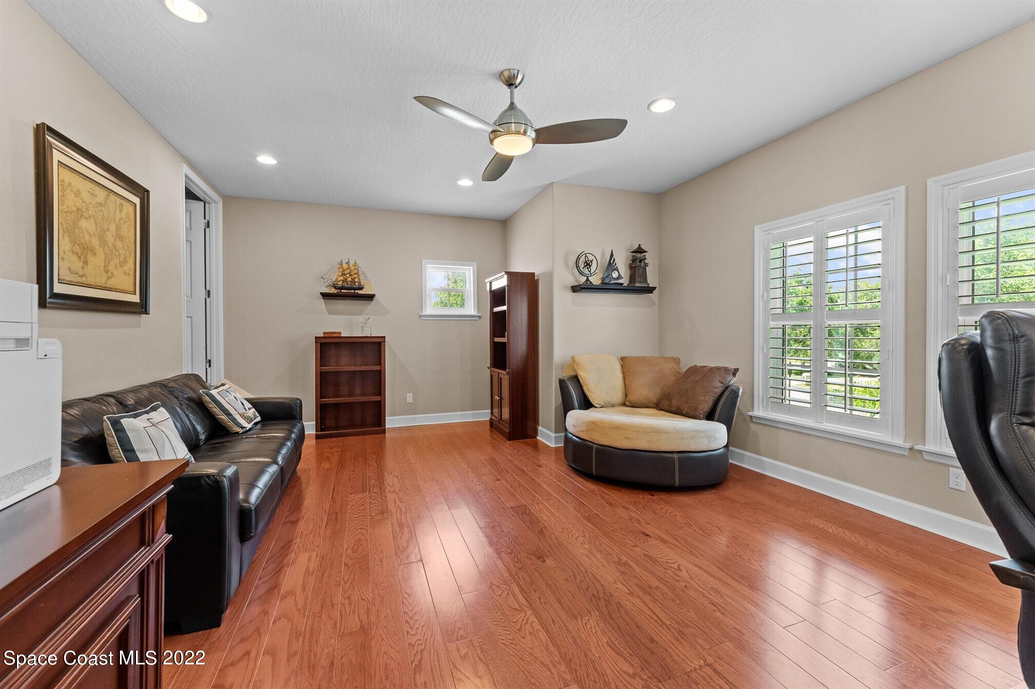 581 Nightingale Drive Indialantic, FL 32903 - Photo 33 of 67 a living room with furniture and a large window