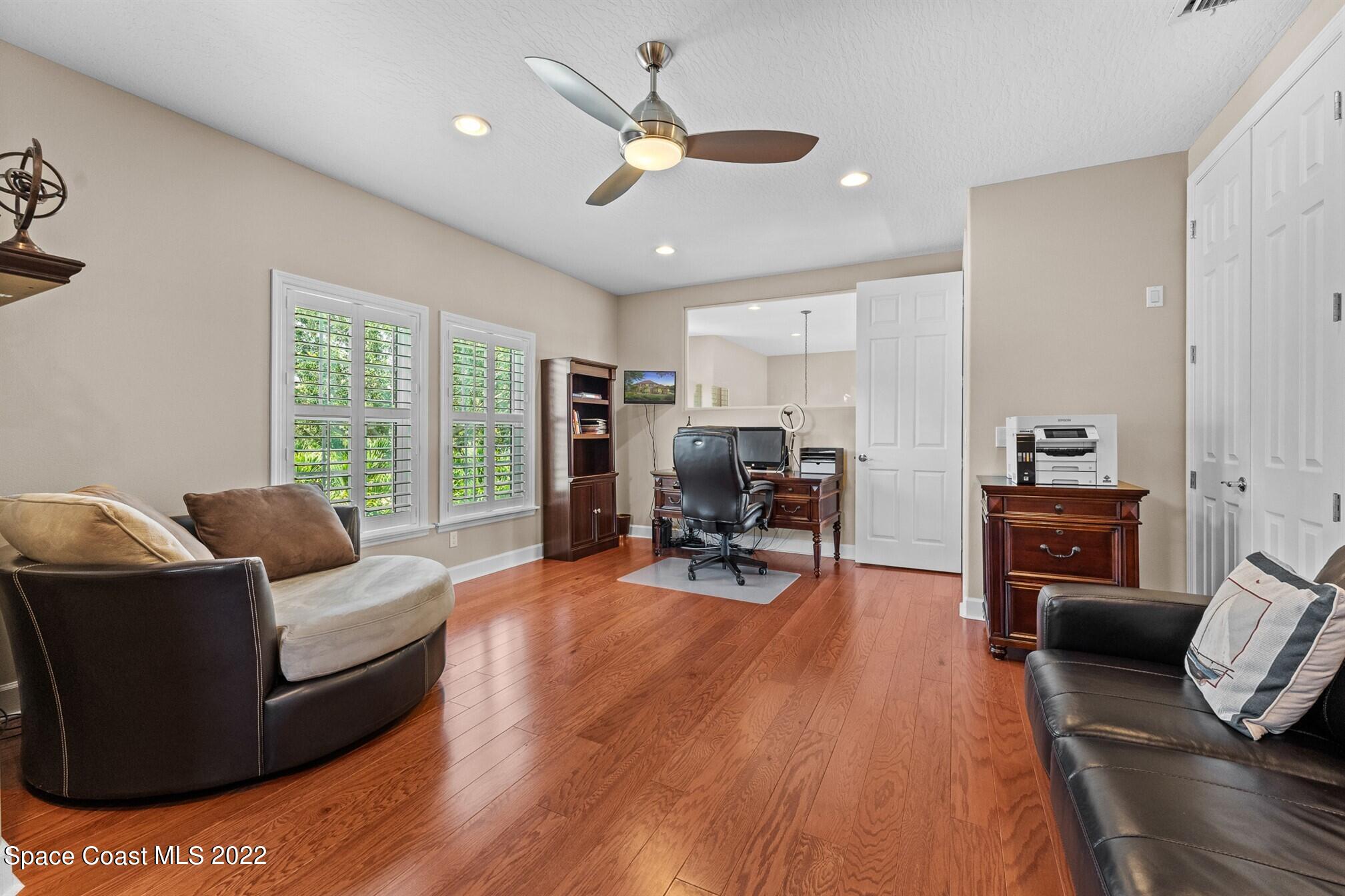 581 Nightingale Drive Indialantic, FL 32903 - Photo 34 of 67 a living room with furniture and a large window