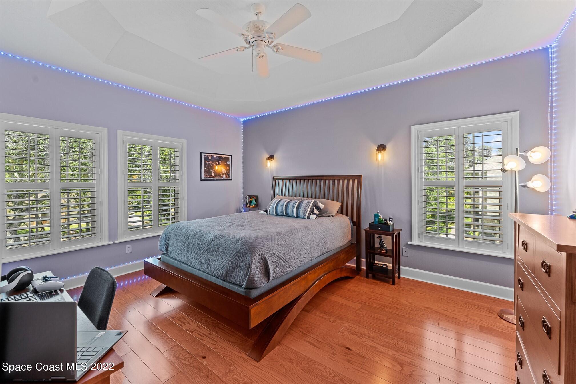 581 Nightingale Drive Indialantic, FL 32903 - Photo 37 of 67 a bedroom with a bed and a window