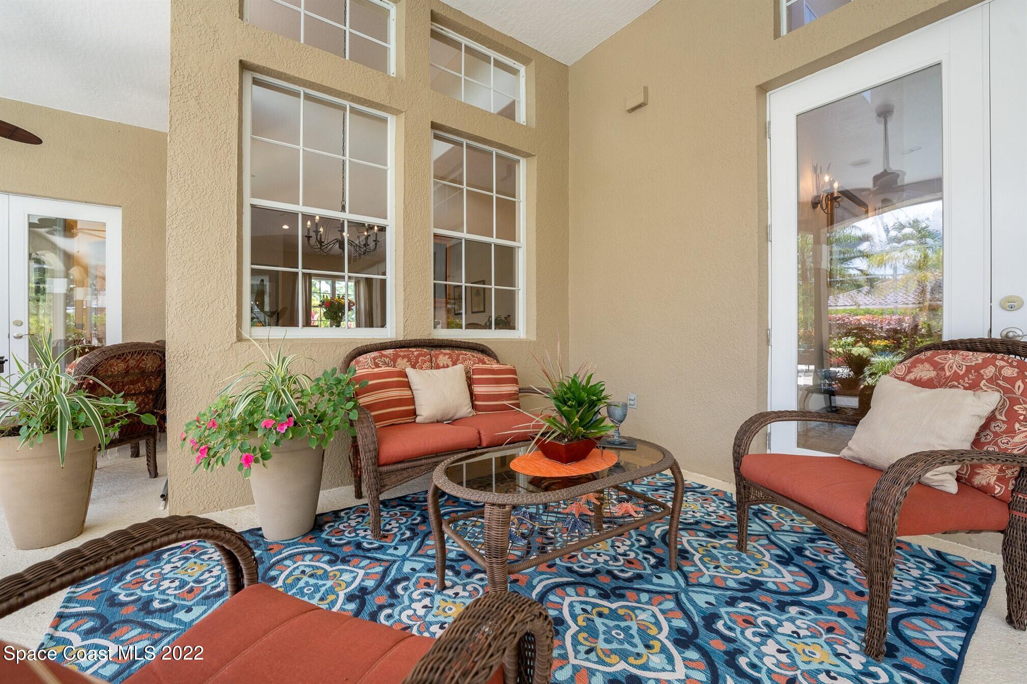 581 Nightingale Drive Indialantic, FL 32903 - Photo 42 of 67 a living room with furniture potted plant and a window